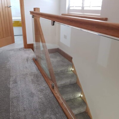 glass and wooden stairs in a house